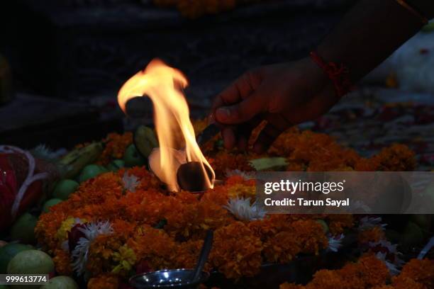 flame at pooja - flame stock-fotos und bilder