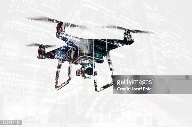 double exposure. hovering drone and city at night. isolated. - jozef polc stock pictures, royalty-free photos & images