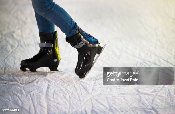 unrecognizable woman ice skating at night in vienna, austria. wi - jozef polc stock pictures, royalty-free photos & images