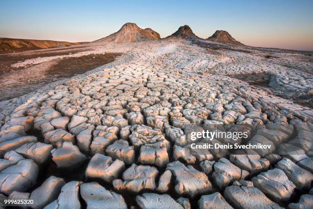 sunrise on a mud volcano - mud imagens e fotografias de stock