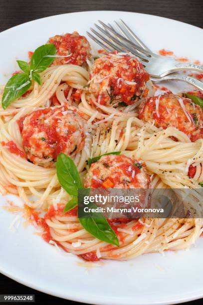 pasta in tomato gravy with meatballs - tomato pasta stock pictures, royalty-free photos & images