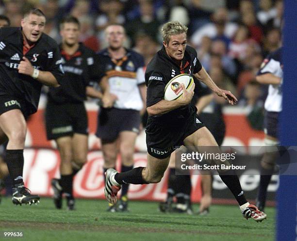 Percy Montgomery of the Stormers sprints in for a try during the Super 12 rugby match between the ACT Brumbies and the Stormers played at Bruce...