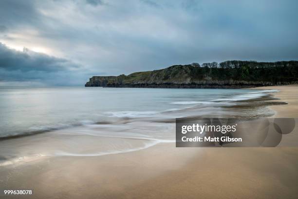 stunning, vibrant sunrise landscape image of barafundle bay on p - dyfed stock pictures, royalty-free photos & images