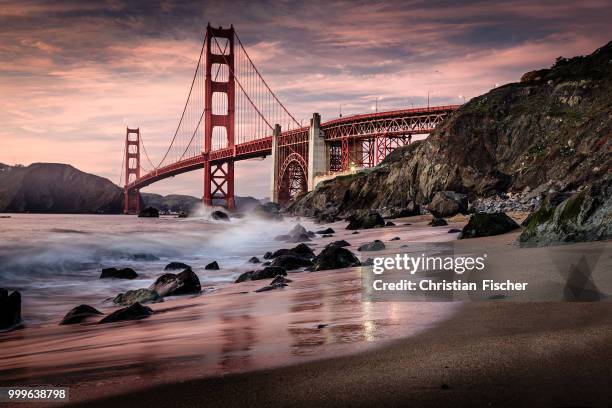 golden gate from marshalls beach - fischer stock pictures, royalty-free photos & images