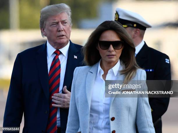 President Donald Trump and First Lady Melania Trump walk towards the Presidential cars after disembarking from Air Force One upon arrival at...