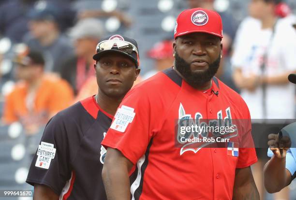 Manager David Ortiz of the World Team and Manager Torii Hunter of the U.S. Team looks on before the SiriusXM All-Star Futures Game at Nationals Park...