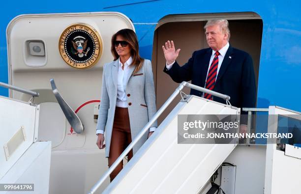 President Donald Trump and First Lady Melania Trump disembark from Air Force One upon arrival at Helsinki-Vantaa Airport in Helsinki, on July 15,...