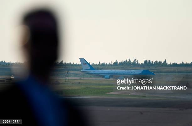 The Air Force One carrying the US President lands at Helsinki-Vantaa Airport in Helsinki, on July 15, 2018 on the eve of a summit in Helsinki between...