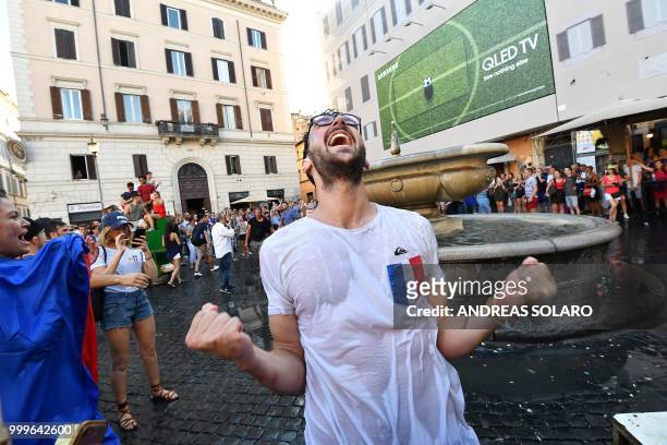 Supporter celebrates France's victory at the end of the Russia 2018 World Cup final football match between France and Croatia, on July 15, 2018 in...