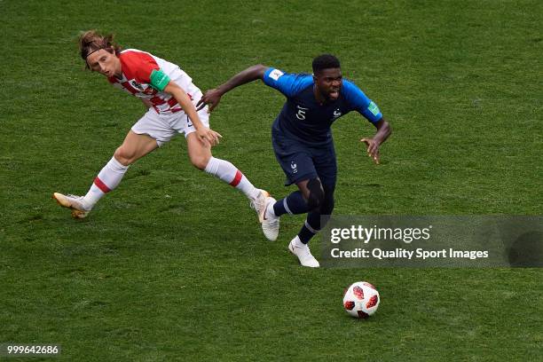 Samuel Umtiti of France competes for the ball with Luka Modric of Croatia during the 2018 FIFA World Cup Russia Final between France and Croatia at...