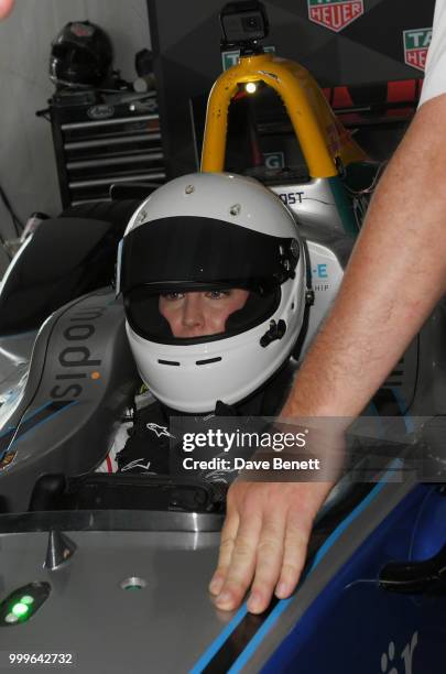 Liv Tyler gets ready to drive a Formula E racing car at the Formula E 2018 Qatar Airways New York City E-Prix, the double header season finale of the...