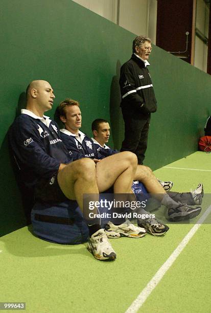 Mark Andrews, Pat Howard and Werner Swanepoel together with their coach Bob Dwyer take a break during Barbarian training at the WRU indoor arena,...