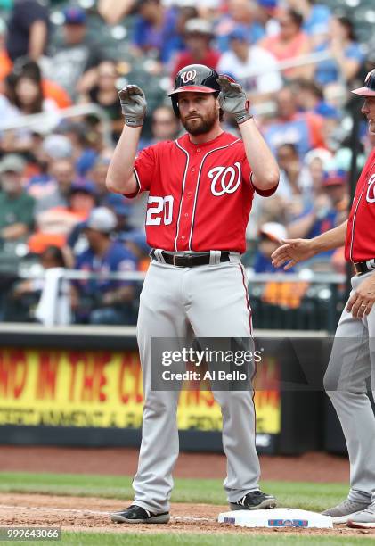 Daniel Murphy of the Washington Nationals reacts after hitting a two run single against the New York Mets in the seventh inning during their game at...