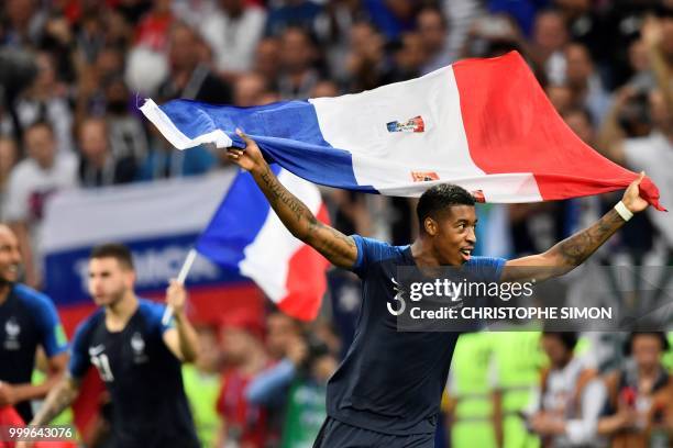 France's defender Presnel Kimpembe celebrates at the end of the Russia 2018 World Cup final football match between France and Croatia at the Luzhniki...