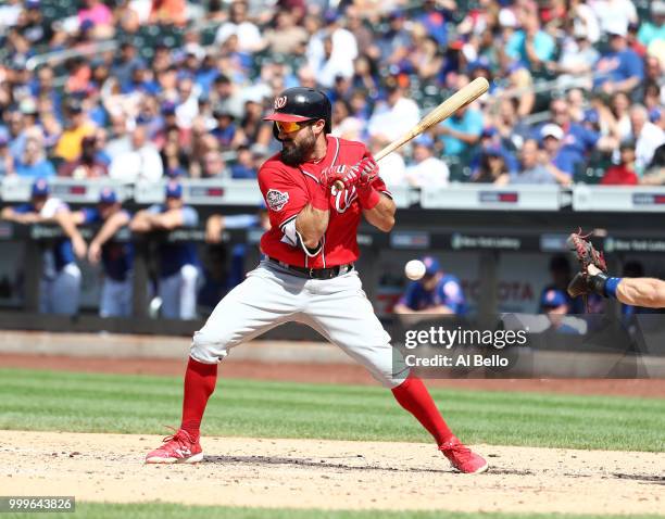 Adam Eaton of the Washington Nationals is hit by a pitch with the bases loaded in the seventh inning against the New York Mets during their game at...