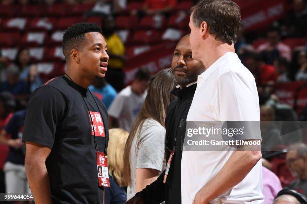 McCollum of the Portland Trail Blazers speaks with Head Coach Terry Stotts of the Portland Trail Blazers before the game between Portland Trail...