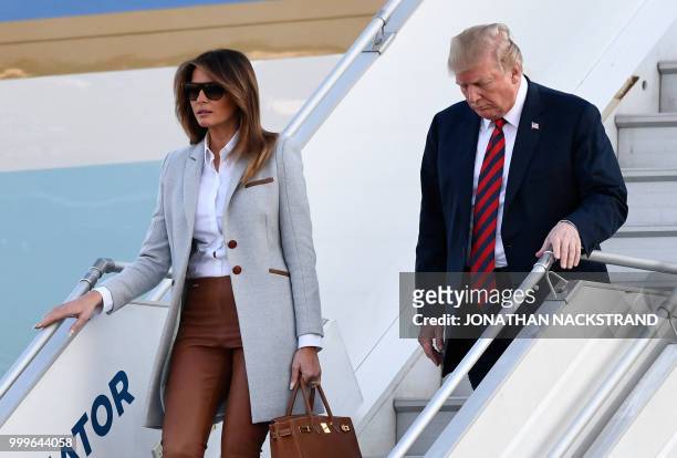 President Donald Trump and First Lady Melania Trump disembark from Air Force One upon arrival at Helsinki-Vantaa Airport in Helsinki, on July 15,...