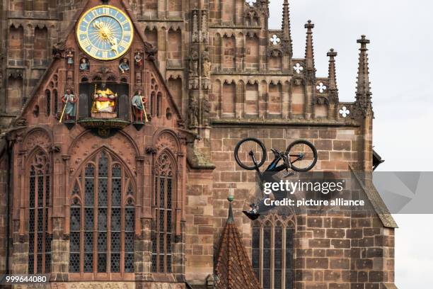 The mountain biker Jakub Vencl from the Czech Republic jumps in front of a backdrop of the Frauenkirche during the finals of the 'Red Bull District...