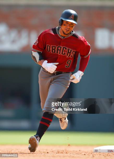 Jon Jay of the Arizona Diamondbacks rounds second after hitting a solo home run in the eighth inning of an MLB game against the Atlanta Braves at...