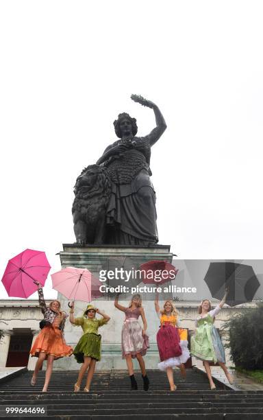 Models Tanja Gremmelmaier , Marie S. , Felicia Gebhardt , Christine Klenner und Isabel Kramer pose on the steps of the Bavaria statue in Munich,...