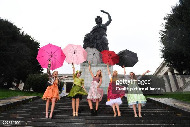 Models Tanja Gremmelmaier , Marie S. , Felicia Gebhardt , Christine Klenner and Isabel Kramer pose on the steps of the Bavaria statue in Munich,...