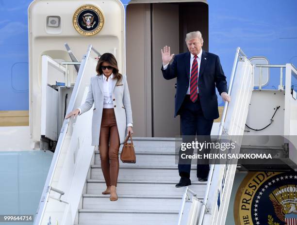 President Donald Trump and First Lady Melania Trump disembark from Air Force One upon arrival at Helsinki-Vantaa Airport in Helsinki, on July 15,...