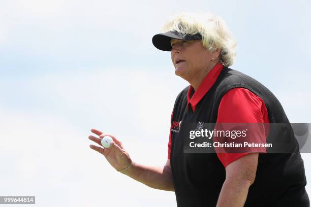 Laura Davies of England reacts after her putt on the 17th green during the final round of the U.S. Senior Women's Open at Chicago Golf Club on July...