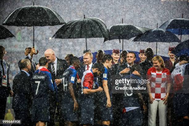 Russian President Vladimir Putin , French President Emmanuel Macron , Croatian President Kolinda Grabar Kitarovic and FIFA President Gianni Infantino...