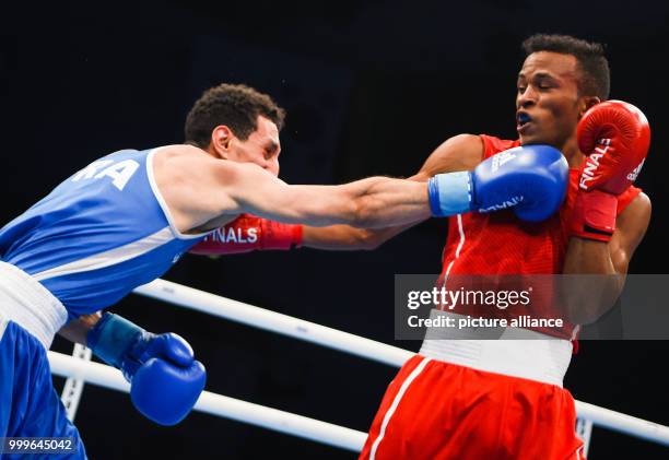 Lazaro Alvarez Estrada of Cuba fighting Sofiane Oumiha of France in the lightweight final bout of the AIBA World Boxing Championships in Hamburg,...