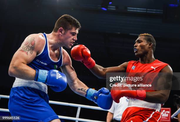 Julio La Cruz fighting Joseph Ward of Ireland in the light heavyweight final bout of the AIBA World Boxing Championships in Hamburg, Germany, 2...