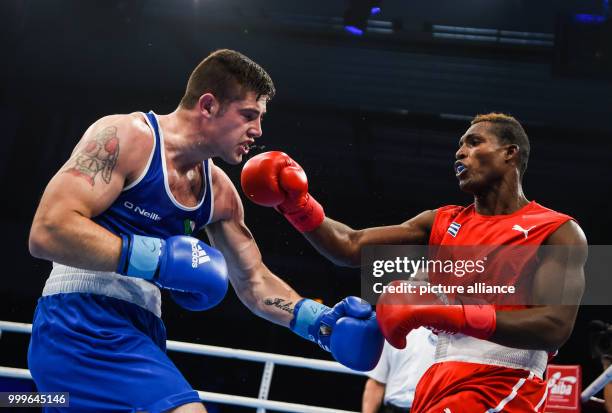 Julio La Cruz fighting Joseph Ward of Ireland in the light heavyweight final bout of the AIBA World Boxing Championships in Hamburg, Germany, 2...