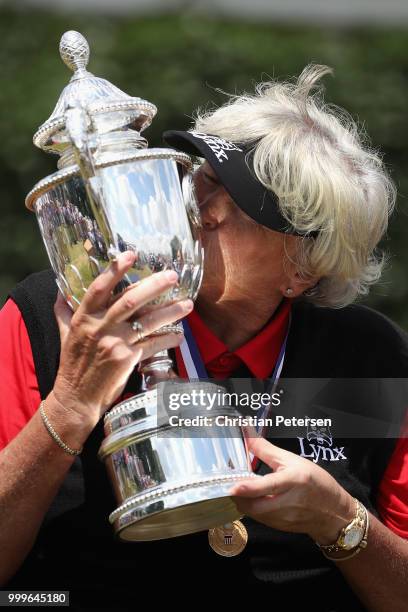 Laura Davies of England celebrates with the U.S. Senior Women's Open trophy after winning in the final round at Chicago Golf Club on July 15, 2018 in...