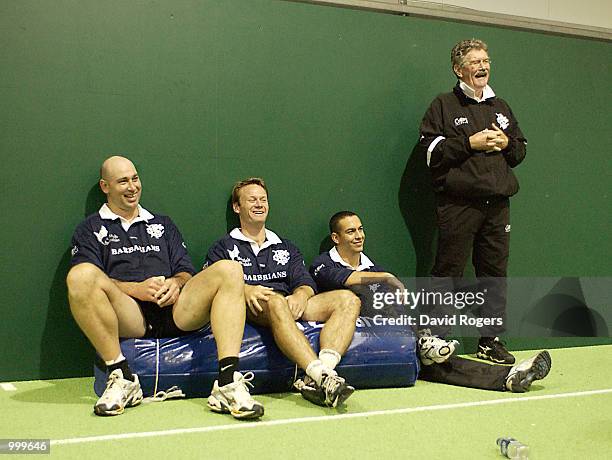 Mark Andrews, Pat Howard and Werner Swanepoel together with their coach Bob Dwyer take a break during Barbarian training at the WRU indoor arena,...