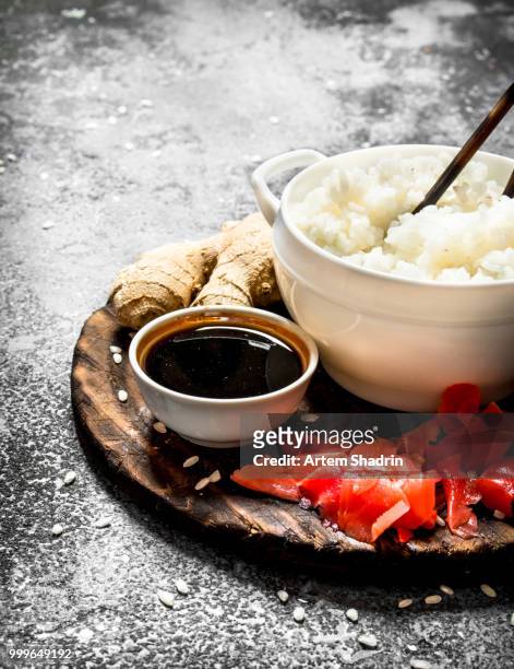 asian food. boiled rice with soy sauce and pickled ginger. on an old rustic background. - pickled ginger bildbanksfoton och bilder
