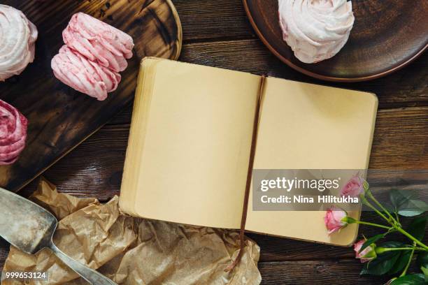 blueberry meringues, flowers on wooden background. empty cooking - nina stock pictures, royalty-free photos & images