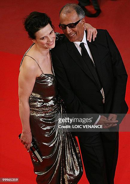 Iranian director Abbas Kiarostami and French actress Juliette Binoche arrive for the screening of "Copie Conforme presented in competition at the...