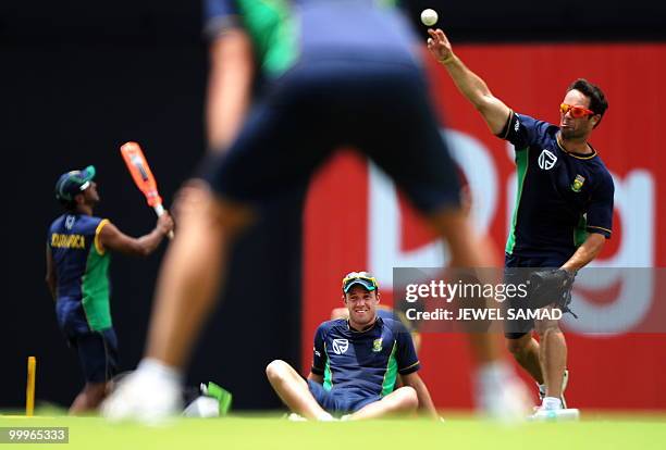 South African cricketer AB de Villiers watches as his teammates practice at Sir Vivian Richards Stadium in St John's on May 18, 2010. South Africa...