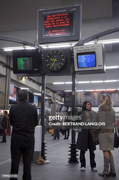 People look at train traffic boards at Montparnasse train station on May 18, 2010 in Paris after French anaesthetist nurses stood on tracks near the...