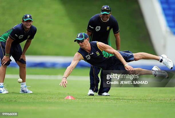 South African cricketer Mark Boucher dives to catch the ball during a practice at Sir Vivian Richards Stadium in St John's on May 18, 2010. South...