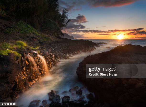 waterfall near queens bath in princeville kauai - princeville stock pictures, royalty-free photos & images
