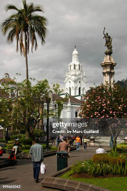 locals walking through a bustling city park in the zona colonial of quito, ecuador, with a stormy clouds passing overhead. - pichincha bildbanksfoton och bilder