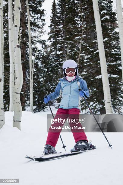 mixed race girl skiing in woods - don mason stock pictures, royalty-free photos & images