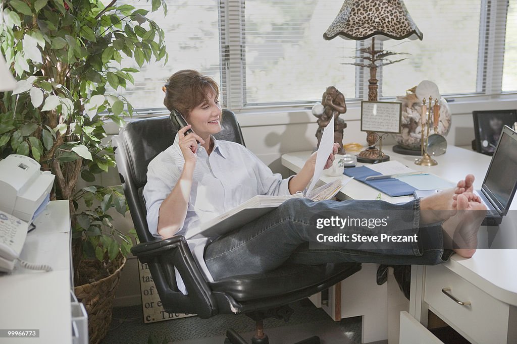 Caucasian businesswoman working in home office