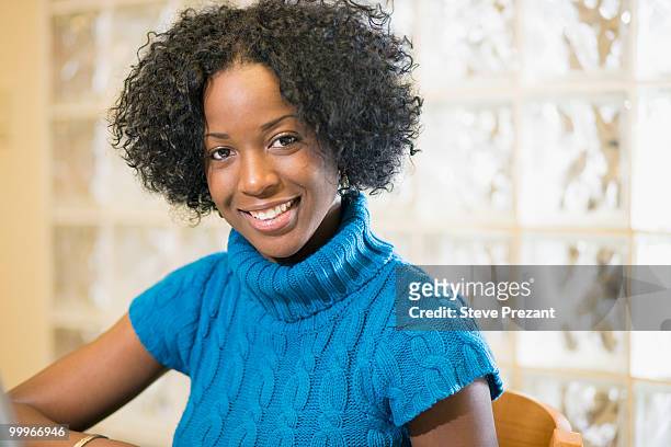 mixed race woman smiling - steve prezant stock pictures, royalty-free photos & images