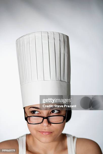 hispanic woman in chef's hat and eyeglasses - steve prezant stock pictures, royalty-free photos & images