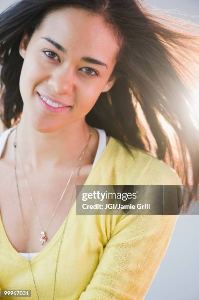 wind blowing mixed race woman's hair - jgi jamie grill stock pictures, royalty-free photos & images