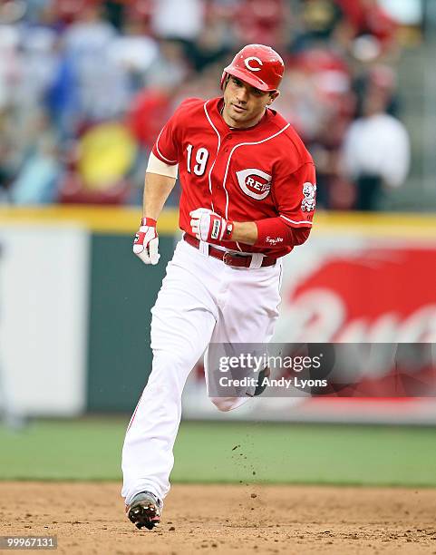 Joey Votto of the Cincinnati Reds runs the bases after hitting a home run in the 8th inning during the game against the Milwaukee Brewers at Great...