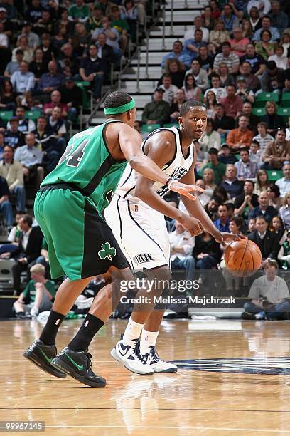 Miles of the Utah Jazz moves the ball against Paul Pierce of the Boston Celtics during the game at EnergySolutions Arena on March 22, 2010 in Salt...