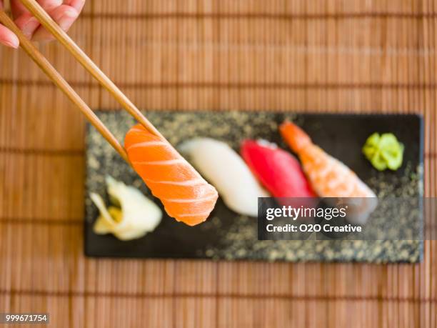 sushi plate - o2o stock pictures, royalty-free photos & images