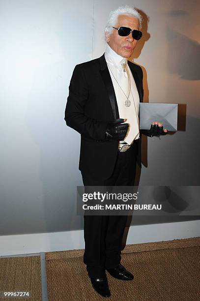 German Designer Karl Lagerfeld arrives to attend the Figaro Madame/Chanel dinner during the 63rd Cannes Film Festival on May 18, 2010 in Cannes. AFP...